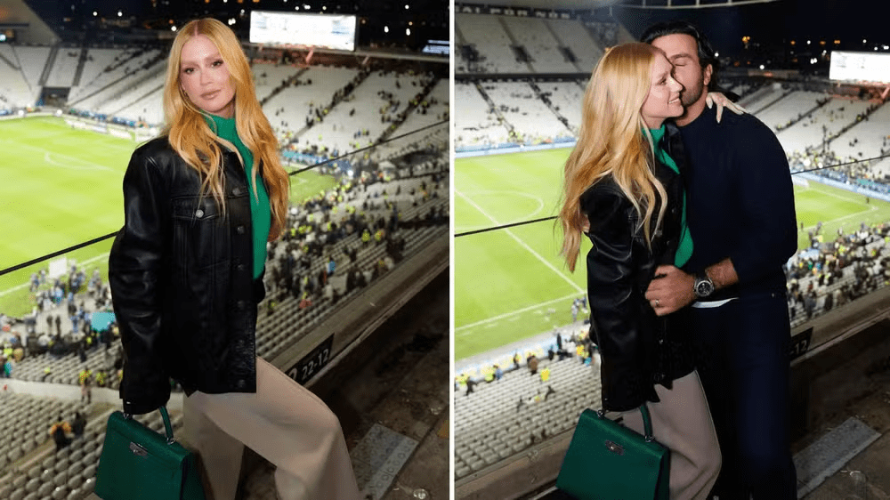 Marina Ruy Barbosa posa ao lado do noivo no estádio em que aconteceu o amistoso da Seleção&nbsp;Brasileira